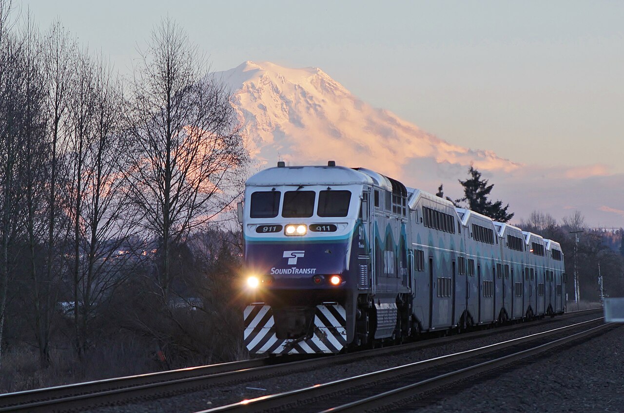 Sounder train near Puyallup with Mount Rainier at sunset